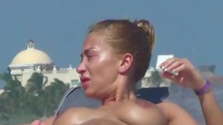 Wonderful woman topless beach sunbathing