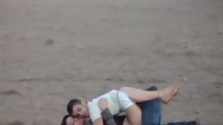 Young paramours making out on the beach voyeur fuck-a-thon tape long lens camera