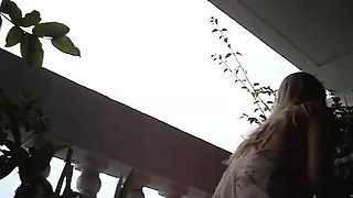 Supah sexy upskirt doll gets filmed at the balcony on the hidden camera